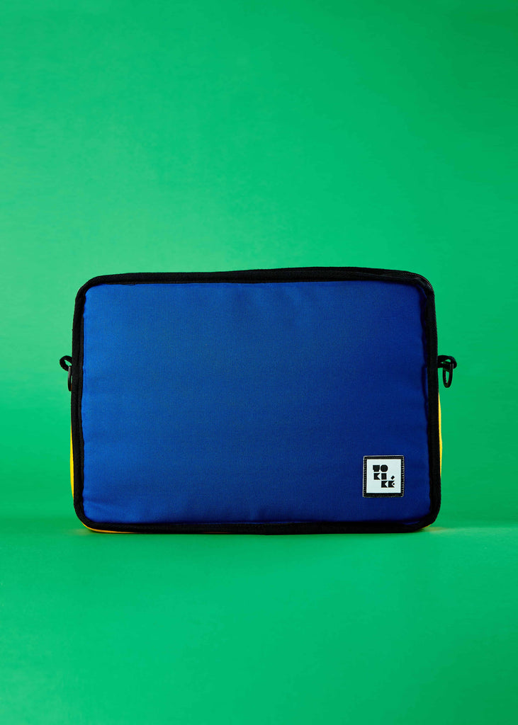 Noa Laptop Sleeve - Embrace Artistic Expression in Your Everyday Carry. A lifestyle shot featuring the Noa laptop sleeve, inviting users to embrace artistic expression in their everyday carry. The Piet Mondrian colorblock artistry brings a unique and creative flair to your tech accessories.