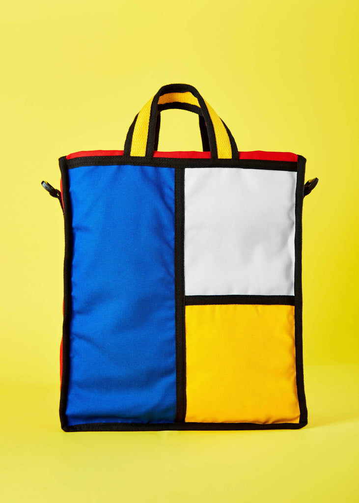 Godewyn Expandable Tote Bag - Piet Mondrian Colorblock Design" "Front view of the Godewyn expandable tote bag, featuring a captivating colorblock pattern inspired by Piet Mondrian's art. The bag showcases bold primary colors and geometric shapes, combining artistic flair with practicality