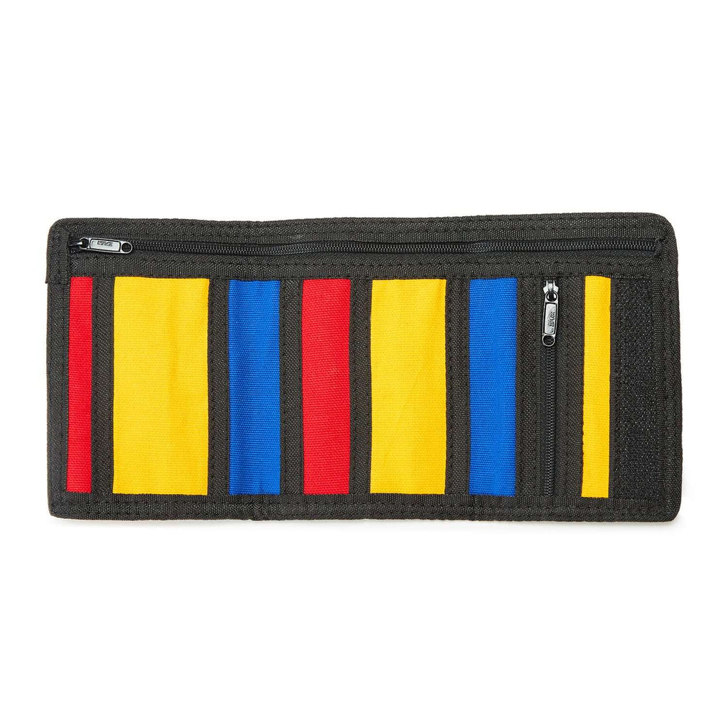 A meticulously designed accessory made of cotton canvas, drawing inspiration from Piet Mondrian's Colorblock art. The wallet features an intricate arrangement of bold color blocks, creating a visually striking and unique design.